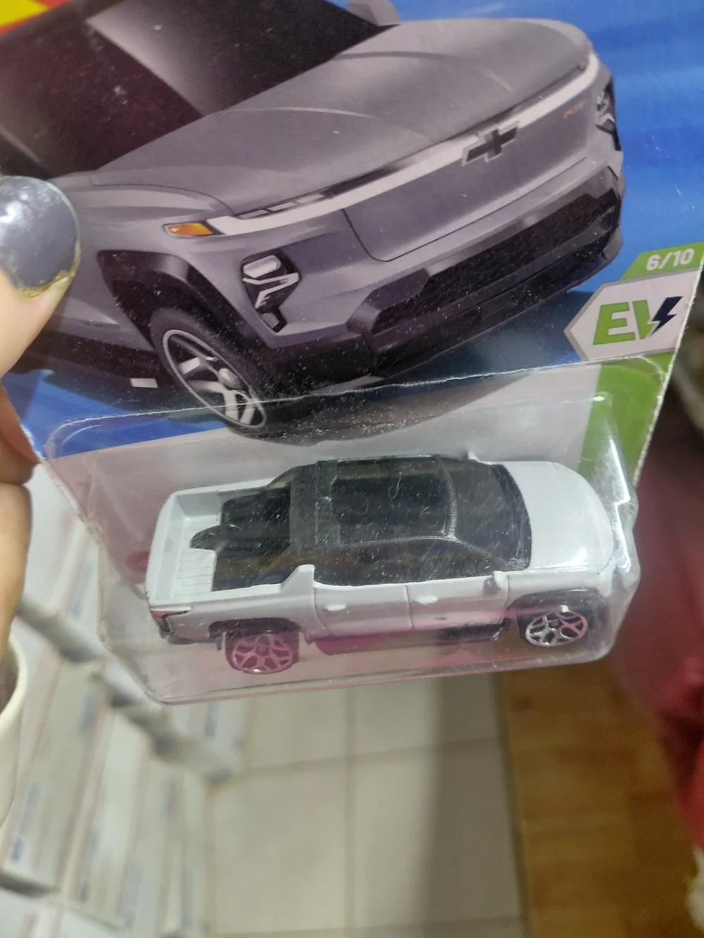 2025 Hot Wheels 1:64 scale diecast Chevrolet Silverado EV RST in matte grey.